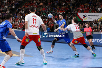 2024-01-13 - Petros Kandylas of Greece and Lukas Lindhard Jorgensen of Denmark during the Men's Euro 2024, Group F handball match between Greece and Denmark on January 13, 2024 at Olympiahalle in Munich, Germany - HANDBALL - MEN'S EHF EURO 2024 - GREECE V DENMARK - HANDBALL - OTHER SPORTS