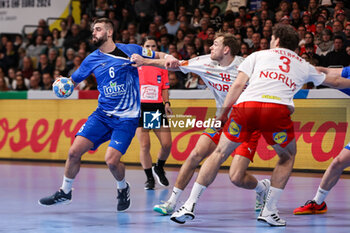 2024-01-13 - Theodoros Boskos of Greece and Mathias Gidsel of Denmark during the Men's Euro 2024, Group F handball match between Greece and Denmark on January 13, 2024 at Olympiahalle in Munich, Germany - HANDBALL - MEN'S EHF EURO 2024 - GREECE V DENMARK - HANDBALL - OTHER SPORTS