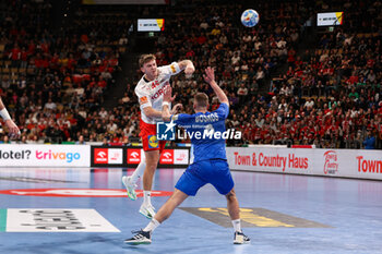 2024-01-13 - Emil Wernsdorf Madsen of Denmark and Theodoros Boskos of Greece during the Men's Euro 2024, Group F handball match between Greece and Denmark on January 13, 2024 at Olympiahalle in Munich, Germany - HANDBALL - MEN'S EHF EURO 2024 - GREECE V DENMARK - HANDBALL - OTHER SPORTS