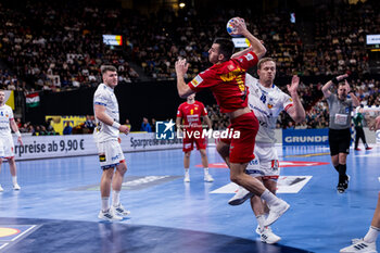 2024-01-14 - Milos Vujovic of Montenegro and Omar Ingi Magnusson of Iceland during the Men's Euro 2024, Group C handball match between Montenegro and Iceland on January 14, 2024 at Olympiahalle in Munich, Germany - HANDBALL - MEN'S EHF EURO 2024 - MONTENEGRO V ICELAND - HANDBALL - OTHER SPORTS