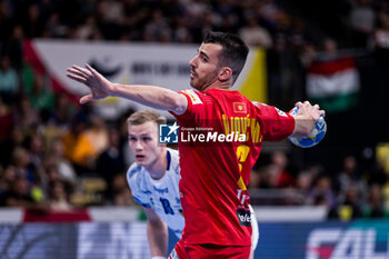 2024-01-14 - Milos Vujovic of Montenegro during the Men's Euro 2024, Group C handball match between Montenegro and Iceland on January 14, 2024 at Olympiahalle in Munich, Germany - HANDBALL - MEN'S EHF EURO 2024 - MONTENEGRO V ICELAND - HANDBALL - OTHER SPORTS