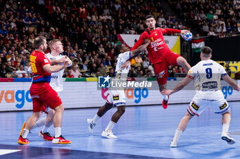 2024-01-14 - Nikola Matovic of Montenegro and Stiven Tobar Valencia of Iceland during the Men's Euro 2024, Group C handball match between Montenegro and Iceland on January 14, 2024 at Olympiahalle in Munich, Germany - HANDBALL - MEN'S EHF EURO 2024 - MONTENEGRO V ICELAND - HANDBALL - OTHER SPORTS