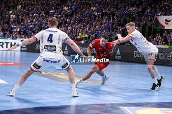 2024-01-14 - Radojica Cepic of Montenegro and Aron Palmarsson, Ellidi Snaer Vidarsson of Iceland during the Men's Euro 2024, Group C handball match between Montenegro and Iceland on January 14, 2024 at Olympiahalle in Munich, Germany - HANDBALL - MEN'S EHF EURO 2024 - MONTENEGRO V ICELAND - HANDBALL - OTHER SPORTS
