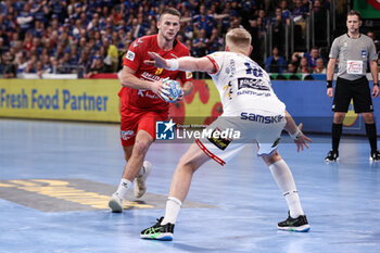 2024-01-14 - Radojica Cepic of Montenegro and Ellidi Snaer Vidarsson of Iceland during the Men's Euro 2024, Group C handball match between Montenegro and Iceland on January 14, 2024 at Olympiahalle in Munich, Germany - HANDBALL - MEN'S EHF EURO 2024 - MONTENEGRO V ICELAND - HANDBALL - OTHER SPORTS
