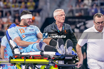 2024-01-15 - Samir Benghanem of The Netherlands leaves the field on a stretcher during the Men's EHF Euro 2024, Group E handball match between Sweden and Netherlands on January 15, 2024 at SAPP Arena in Mannheim, Germany - HANDBALL - MEN'S EHF EURO 2024 - SWEDEN V NETHERLANDS - HANDBALL - OTHER SPORTS
