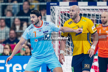 2024-01-15 - Oscar Bergendahl of Sweden is challenged by Robin Schoenaker of The Netherlands during the Men's EHF Euro 2024, Group E handball match between Sweden and Netherlands on January 15, 2024 at SAPP Arena in Mannheim, Germany - HANDBALL - MEN'S EHF EURO 2024 - SWEDEN V NETHERLANDS - HANDBALL - OTHER SPORTS
