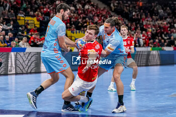 2024-01-17 - Lukas Lindhard Jorgensen of Denmark is challenged by Robin Schoenaker and Iso Sluijters of The Netherlands during the Men's EHF Euro 2024, Group E handball match between Denmark and Netherlands on January 17, 2024 at Barclays Arena in Hamburg, Germany - HANDBALL - MEN'S EHF EURO 2024 - DENMARK V NETHERLANDS - HANDBALL - OTHER SPORTS