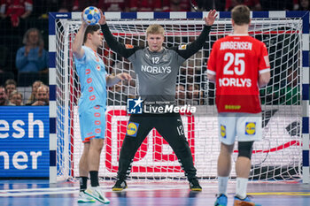 2024-01-17 - Emil Nielsen of Denmark is challenged by Rutger ten Velde of The Netherlands during the Men's EHF Euro 2024, Group E handball match between Denmark and Netherlands on January 17, 2024 at Barclays Arena in Hamburg, Germany - HANDBALL - MEN'S EHF EURO 2024 - DENMARK V NETHERLANDS - HANDBALL - OTHER SPORTS