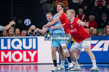 2024-01-17 - Ivar Stavast of The Netherlands is challenged by Niclas Vest Kirkelokke and Magnus Saugstrup Jensen of Denmark during the Men's EHF Euro 2024, Group E handball match between Denmark and Netherlands on January 17, 2024 at Barclays Arena in Hamburg, Germany - HANDBALL - MEN'S EHF EURO 2024 - DENMARK V NETHERLANDS - HANDBALL - OTHER SPORTS