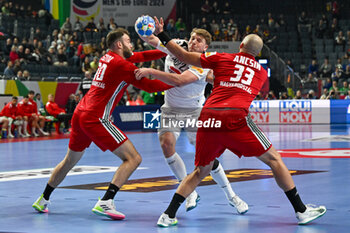 2024-01-18 - Lukas Hutecek (Austria) in action against Gabor Ancsin (Hungary) during the Men’s EHF Euro 2024 match between Hungary vs.Austria at the Lanxess Arena in Berlin, Cologne - MEN'S EHF EURO 2024 - HUNGARY VS AUSTRIA - HANDBALL - OTHER SPORTS