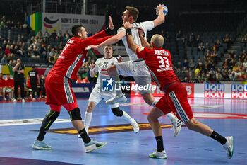 2024-01-18 - Mykola Bilyk (Austria) in action against Gabor Ancsin (Hungary) during the Men’s EHF Euro 2024 match between Hungary vs.Austria at the Lanxess Arena in Berlin, Cologne - MEN'S EHF EURO 2024 - HUNGARY VS AUSTRIA - HANDBALL - OTHER SPORTS
