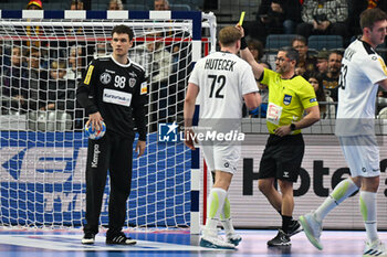 2024-01-18 - Yellow Card for Lukas Hutecek (Austria) during the Men’s EHF Euro 2024 match between Hungary vs.Austria at the Lanxess Arena in Berlin, Cologne - MEN'S EHF EURO 2024 - HUNGARY VS AUSTRIA - HANDBALL - OTHER SPORTS