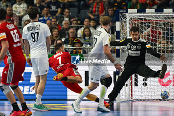 2024-01-18 - Janko Bozovic (Austria) scores a goal during the Men’s EHF Euro 2024 match between Hungary vs.Austria at the Lanxess Arena in Berlin, Cologne - MEN'S EHF EURO 2024 - HUNGARY VS AUSTRIA - HANDBALL - OTHER SPORTS