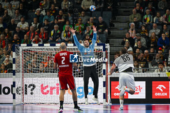 2024-01-18 - Lob from Tobias Wagner (Austria) against Kristof Laszlo Palasics (Hungary) during the Men’s EHF Euro 2024 match between Hungary vs.Austria at the Lanxess Arena in Berlin, Cologne - MEN'S EHF EURO 2024 - HUNGARY VS AUSTRIA - HANDBALL - OTHER SPORTS