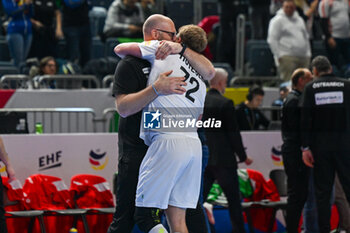 2024-01-18 - Happiness of Head coach Ales Pajovic (Austria) and Lukas Hutecek (Austria) after win the Men’s EHF Euro 2024 match between Hungary vs.Austria at the Lanxess Arena in Berlin, Cologne - MEN'S EHF EURO 2024 - HUNGARY VS AUSTRIA - HANDBALL - OTHER SPORTS