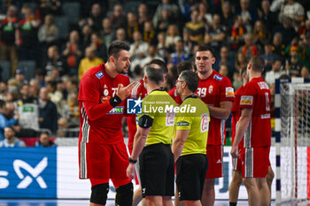 2024-01-18 - Bence Banhidi (Hungary) complain with the referee for the last decision after the Men’s EHF Euro 2024 match between Hungary vs.Austria at the Lanxess Arena in Berlin, Cologne - MEN'S EHF EURO 2024 - HUNGARY VS AUSTRIA - HANDBALL - OTHER SPORTS