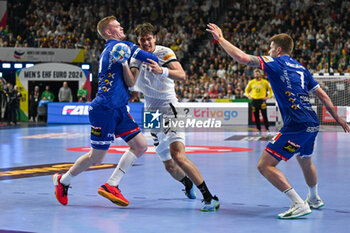 2024-01-18 - Julian Koster (Germany) in action against Ymir Gislason (Iceland) during the Men’s EHF Euro 2024 match between Germany vs. Iceland at the Lanxess Arena in Berlin, Cologne - MEN'S EHF EURO 2024 - GERMANY VS ICELAND - HANDBALL - OTHER SPORTS