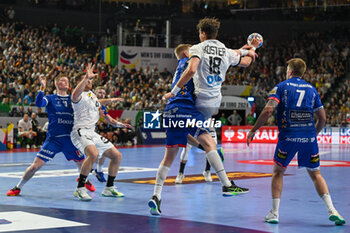 2024-01-18 - Julian Koster (Germany) in action against Ellioi Vioarsson (Iceland) during the Men’s EHF Euro 2024 match between Germany vs. Iceland at the Lanxess Arena in Berlin, Cologne - MEN'S EHF EURO 2024 - GERMANY VS ICELAND - HANDBALL - OTHER SPORTS