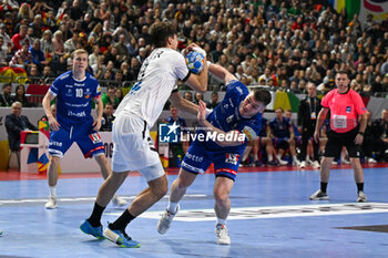 2024-01-18 - Aron Palmarsson (Iceland) in action against Julian Koster (Germany) during the Men’s EHF Euro 2024 match between Germany vs. Iceland at the Lanxess Arena in Berlin, Cologne - MEN'S EHF EURO 2024 - GERMANY VS ICELAND - HANDBALL - OTHER SPORTS