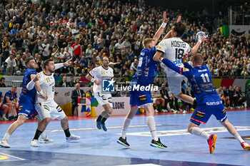 2024-01-18 - Julian Koster (Germany) in action against Ellioi Vioarsson (Iceland) and Ymir Gislason (Iceland) during the Men’s EHF Euro 2024 match between Germany vs. Iceland at the Lanxess Arena in Berlin, Cologne - MEN'S EHF EURO 2024 - GERMANY VS ICELAND - HANDBALL - OTHER SPORTS