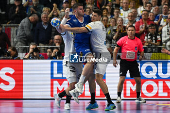 2024-01-18 - Bjarki Mar Elisson (Iceland) in action against Sebastian Heymann (Germany) during the Men’s EHF Euro 2024 match between Germany vs. Iceland at the Lanxess Arena in Berlin, Cologne - MEN'S EHF EURO 2024 - GERMANY VS ICELAND - HANDBALL - OTHER SPORTS