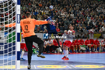 2024-01-18 - Dika Mem (France) in action against Matej Mandic (Croatia) during the Men’s EHF Euro 2024 match between France vs. Croatia at the Lanxess Arena in Berlin, Cologne - MEN'S EHF EURO 2024 - FRANCE VS CROATIA - HANDBALL - OTHER SPORTS