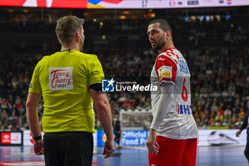 2024-01-18 - Mario Sostaric (Croatia) shows his disappointment with the referee during the Men’s EHF Euro 2024 match between France vs. Croatia at the Lanxess Arena in Berlin, Cologne - MEN'S EHF EURO 2024 - FRANCE VS CROATIA - HANDBALL - OTHER SPORTS