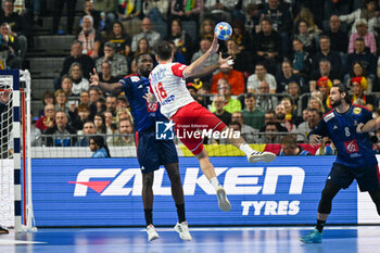 2024-01-18 - Igor Karacic (Croatia) in action against Dylan Nahi (France) during the Men’s EHF Euro 2024 match between France vs. Croatia at the Lanxess Arena in Berlin, Cologne - MEN'S EHF EURO 2024 - FRANCE VS CROATIA - HANDBALL - OTHER SPORTS