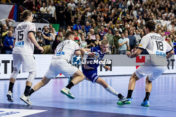 2024-01-18 - Ellidi Vidarsson of Iceland and Johannes Golla, Julian Köster of Germany during the Men's EHF Euro 2024, Main Round, handball match between Germany and Iceland on January 18, 2024 at Lanxess-Arena in Cologne, Germany - HANDBALL - MEN'S EHF EURO 2024 - GERMANY V ICELAND - HANDBALL - OTHER SPORTS