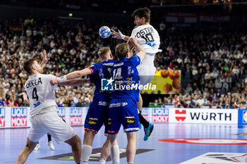 2024-01-18 - Julian Köster of Germany passes the ball to Johannes Golla of Germany under pression of Ellidi Vidarsson, Omar Ingi Magnusson of Iceland during the Men's EHF Euro 2024, Main Round, handball match between Germany and Iceland on January 18, 2024 at Lanxess-Arena in Cologne, Germany - HANDBALL - MEN'S EHF EURO 2024 - GERMANY V ICELAND - HANDBALL - OTHER SPORTS