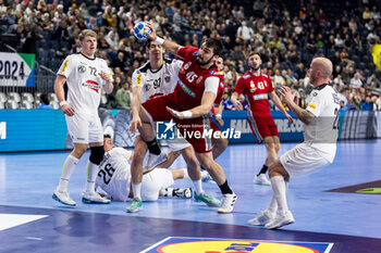 2024-01-18 - Miklos Rosta of Hungary and Michael Miskovez, Robert Weber of Austria during the Men's EHF Euro 2024, Main Round, handball match between Hungary and Austria on January 18, 2024 at Lanxess-Arena in Cologne, Germany - HANDBALL - MEN'S EHF EURO 2024 - HUNGARY V AUSTRIA - HANDBALL - OTHER SPORTS
