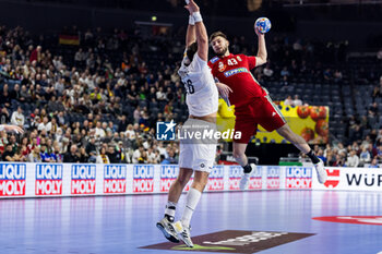 2024-01-18 - Zoran Ilic of Hungary and Lukas Herburger of Austria during the Men's EHF Euro 2024, Main Round, handball match between Hungary and Austria on January 18, 2024 at Lanxess-Arena in Cologne, Germany - HANDBALL - MEN'S EHF EURO 2024 - HUNGARY V AUSTRIA - HANDBALL - OTHER SPORTS