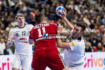 2024-01-18 - Mykola Bilyk of Austria and Patrik Ligetvari of Hungary during the Men's EHF Euro 2024, Main Round, handball match between Hungary and Austria on January 18, 2024 at Lanxess-Arena in Cologne, Germany - HANDBALL - MEN'S EHF EURO 2024 - HUNGARY V AUSTRIA - HANDBALL - OTHER SPORTS