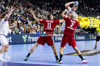 2024-01-18 - Lukas Hutecek of Austria and Patrik Ligetvari, Adrian Sipos of Hungary during the Men's EHF Euro 2024, Main Round, handball match between Hungary and Austria on January 18, 2024 at Lanxess-Arena in Cologne, Germany - HANDBALL - MEN'S EHF EURO 2024 - HUNGARY V AUSTRIA - HANDBALL - OTHER SPORTS