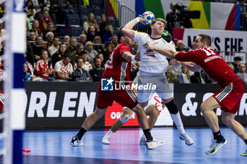 2024-01-18 - Lukas Hutecek of Austria and Patrik Ligetvari of Hungary during the Men's EHF Euro 2024, Main Round, handball match between Hungary and Austria on January 18, 2024 at Lanxess-Arena in Cologne, Germany - HANDBALL - MEN'S EHF EURO 2024 - HUNGARY V AUSTRIA - HANDBALL - OTHER SPORTS