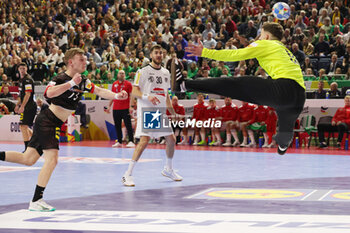 2024-01-20 - Timo Kastening of Germany and Constantin Möstl of Austria during the Men's EHF Euro 2024, Main Round, handball match between Germany and Austria on January 20, 2024 at Lanxess-Arena in Cologne, Germany - HANDBALL - MEN'S EHF EURO 2024 - GERMANY V AUSTRIA - HANDBALL - OTHER SPORTS