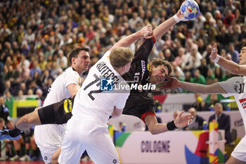 2024-01-20 - Julian Köster of Germany and Lukas Hutecek of Austria during the Men's EHF Euro 2024, Main Round, handball match between Germany and Austria on January 20, 2024 at Lanxess-Arena in Cologne, Germany - HANDBALL - MEN'S EHF EURO 2024 - GERMANY V AUSTRIA - HANDBALL - OTHER SPORTS