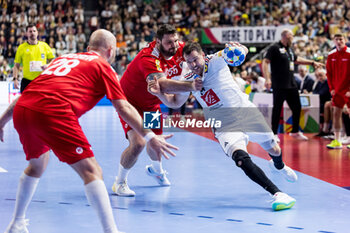 2024-01-22 - Kentin Mahe of France and Tobias Wagner of Austria during the Men's EHF Euro 2024, Main Round, handball match between France and Austria on January 22, 2024 at Lanxess-Arena in Cologne, Germany - HANDBALL - MEN'S EHF EURO 2024 - FRANCE V AUSTRIA - HANDBALL - OTHER SPORTS