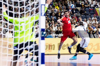 2024-01-22 - Janko Bozovic of Austria and Elohim Prandi of France during the Men's EHF Euro 2024, Main Round, handball match between France and Austria on January 22, 2024 at Lanxess-Arena in Cologne, Germany - HANDBALL - MEN'S EHF EURO 2024 - FRANCE V AUSTRIA - HANDBALL - OTHER SPORTS