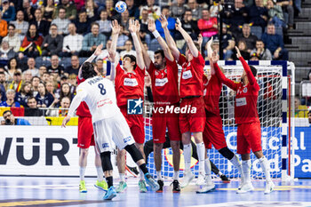 2024-01-22 - Wall of Austria and Elohim Prandi of France during the Men's EHF Euro 2024, Main Round, handball match between France and Austria on January 22, 2024 at Lanxess-Arena in Cologne, Germany - HANDBALL - MEN'S EHF EURO 2024 - FRANCE V AUSTRIA - HANDBALL - OTHER SPORTS