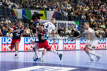 2024-01-22 - Luka Cindric of Croatia and Aron Palmarsson of Iceland during the Men's EHF Euro 2024, Main Round, handball match between Croatia and Iceland on January 22, 2024 at Lanxess-Arena in Cologne, Germany - HANDBALL - MEN'S EHF EURO 2024 - CROATIA V ICELAND - HANDBALL - OTHER SPORTS