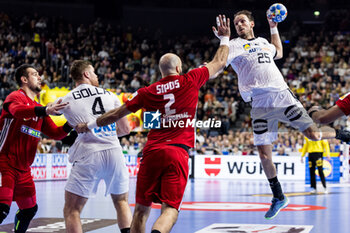 2024-01-22 - Kai Häfner of Germany and Adrian Sipos of Hungary during the Men's EHF Euro 2024, Main Round, handball match between Germany and Hungary on January 22, 2024 at Lanxess-Arena in Cologne, Germany - HANDBALL - MEN'S EHF EURO 2024 - GERMANY V HUNGARY - HANDBALL - OTHER SPORTS
