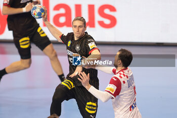 2024-01-24 - Juri Knorr of Germany and Domagoj Duvnjak of Croatia during the Men's EHF Euro 2024, Main Round, handball match between Germany and Croatia on January 24, 2024 at Lanxess-Arena in Cologne, Germany - HANDBALL - MEN'S EHF EURO 2024 - GERMANY V CROATIA - HANDBALL - OTHER SPORTS