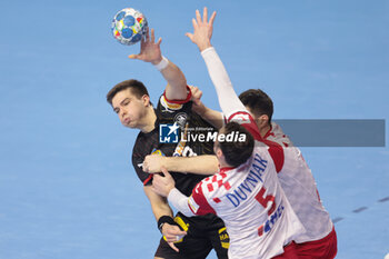 2024-01-24 - Renars Uscins of Germany and Domagoj Duvnjak of Croatia during the Men's EHF Euro 2024, Main Round, handball match between Germany and Croatia on January 24, 2024 at Lanxess-Arena in Cologne, Germany - HANDBALL - MEN'S EHF EURO 2024 - GERMANY V CROATIA - HANDBALL - OTHER SPORTS