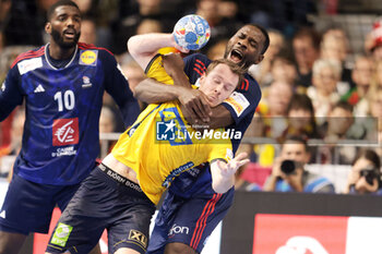 2024-01-26 - Felix Claar of Sweden and Karl Konan of France during the Men's EHF Euro 2024, Semi Finals handball match between France and Sweden on January 26, 2024 at Lanxess-Arena in Cologne, Germany - HANDBALL - MEN'S EHF EURO 2024 - FRANCE V SWEDEN - HANDBALL - OTHER SPORTS