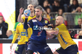 2024-01-26 - Luka Karabatic of France and Oscar Bergendahl of Sweden during the Men's EHF Euro 2024, Semi Finals handball match between France and Sweden on January 26, 2024 at Lanxess-Arena in Cologne, Germany - HANDBALL - MEN'S EHF EURO 2024 - FRANCE V SWEDEN - HANDBALL - OTHER SPORTS
