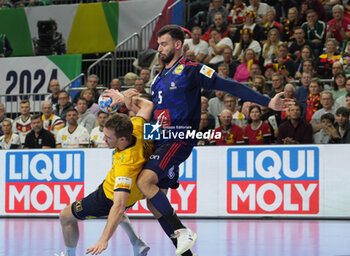 2024-01-26 - Nedim Remili of France and Felix Claar of Sweden during the Men's EHF Euro 2024, Semi Finals handball match between France and Sweden on January 26, 2024 at Lanxess-Arena in Cologne, Germany - HANDBALL - MEN'S EHF EURO 2024 - FRANCE V SWEDEN - HANDBALL - OTHER SPORTS