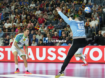 2024-01-26 - Dean Bombac of Slovenia and Laszlo Bartucz of Hungary during the Men's EHF Euro 2024, Placement match 5/6, handball match between Hungary and Slovenia on January 26, 2024 at Lanxess-Arena in Cologne, Germany - HANDBALL - MEN'S EHF EURO 2024 - HUNGARY V SLOVENIA - HANDBALL - OTHER SPORTS