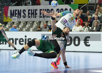 2024-01-26 - Bence Banhidi of Hungary and Nejc Cehte of Slovenia during the Men's EHF Euro 2024, Placement match 5/6, handball match between Hungary and Slovenia on January 26, 2024 at Lanxess-Arena in Cologne, Germany - HANDBALL - MEN'S EHF EURO 2024 - HUNGARY V SLOVENIA - HANDBALL - OTHER SPORTS