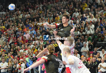 2024-01-26 - Julian Köster of Germany and Magnus Saugstrup Jensen of Denmark during the Men's EHF Euro 2024, Semi Finals handball match between Germany and Denmark on January 26, 2024 at Lanxess-Arena in Cologne, Germany - HANDBALL - MEN'S EHF EURO 2024 - GERMANY V DENMARK - HANDBALL - OTHER SPORTS
